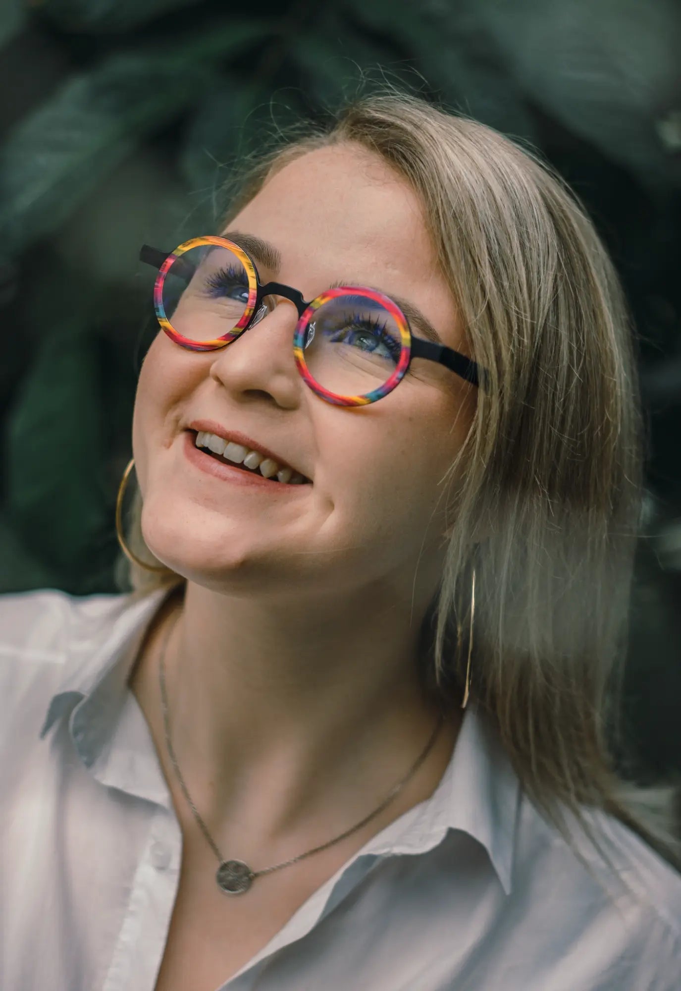 Model wearing Rainbow Stripe titanium eyeglasses