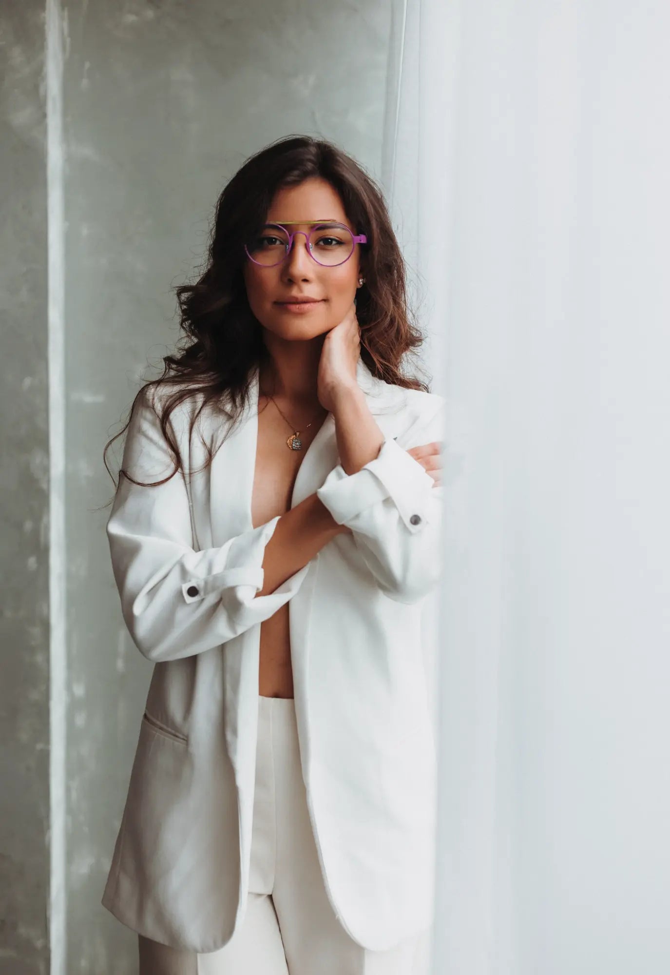 Fashion model wearing VoyueLens™ NeoPilot glasses in Candy Lime color-block titanium frame with pink-green tones, part of the NeoPilot series, highlighting style and fit