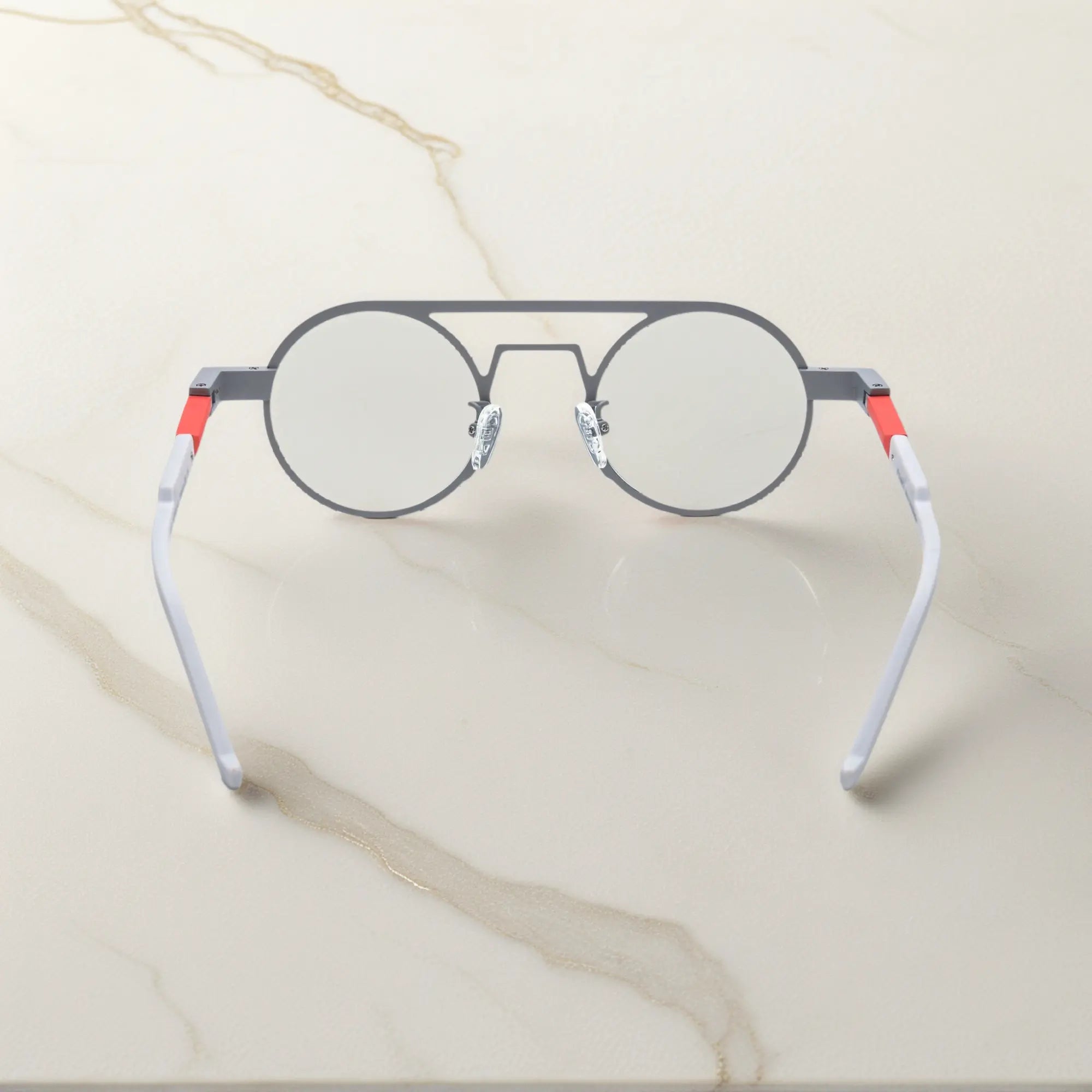 Rear angle displaying the ergonomic nose pads and lightweight design in Chrome Ember sleek silver titanium frame with a subtle industrial edge