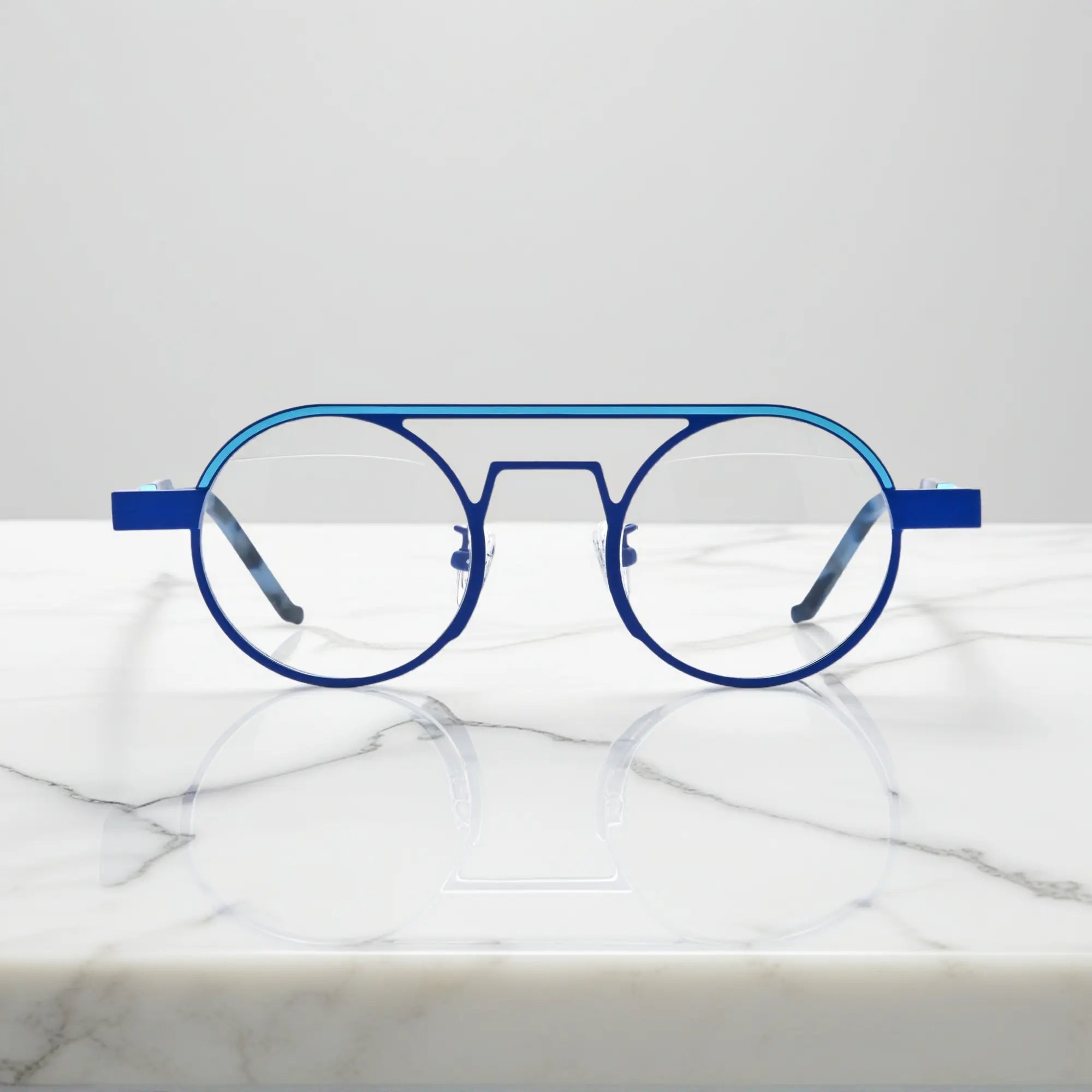 Front view of VoyueLens™ NeoPilot aviator glasses in Glacier Blue icy titanium aviator frame with a cool, futuristic tone