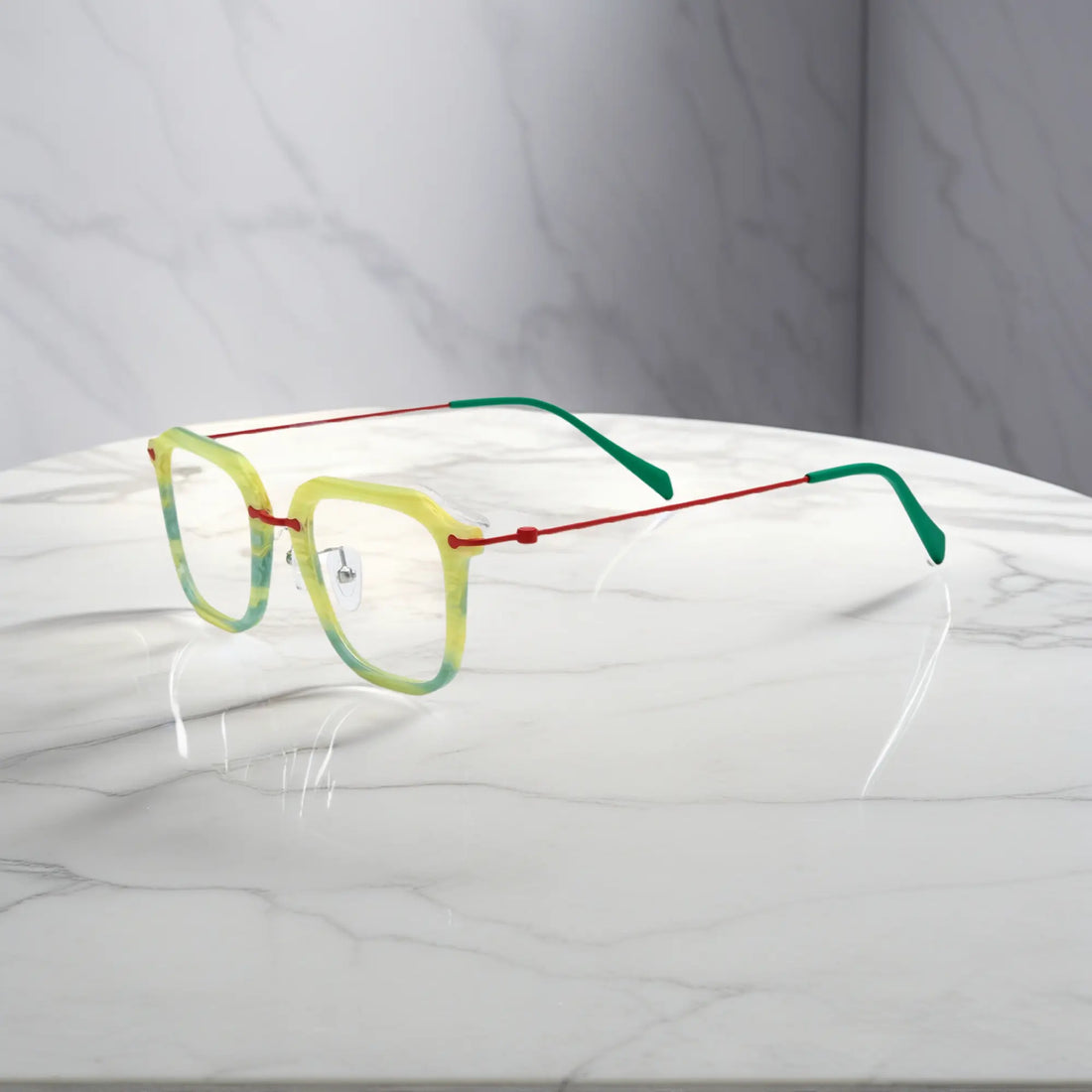 Angled side perspective showing the lightweight titanium temples and vibrant Citrus Mist colorway.
