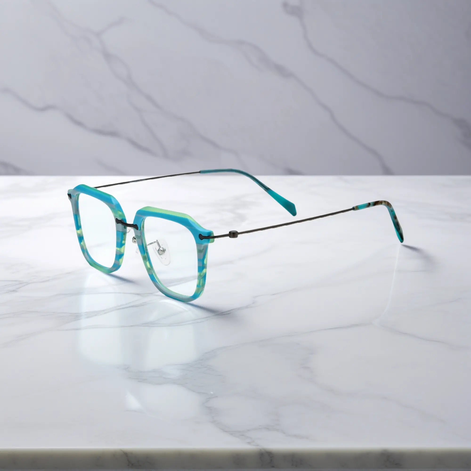 Diagonal side view of the Urban Vision frame in Glacier Teal with metallic titanium temples.
