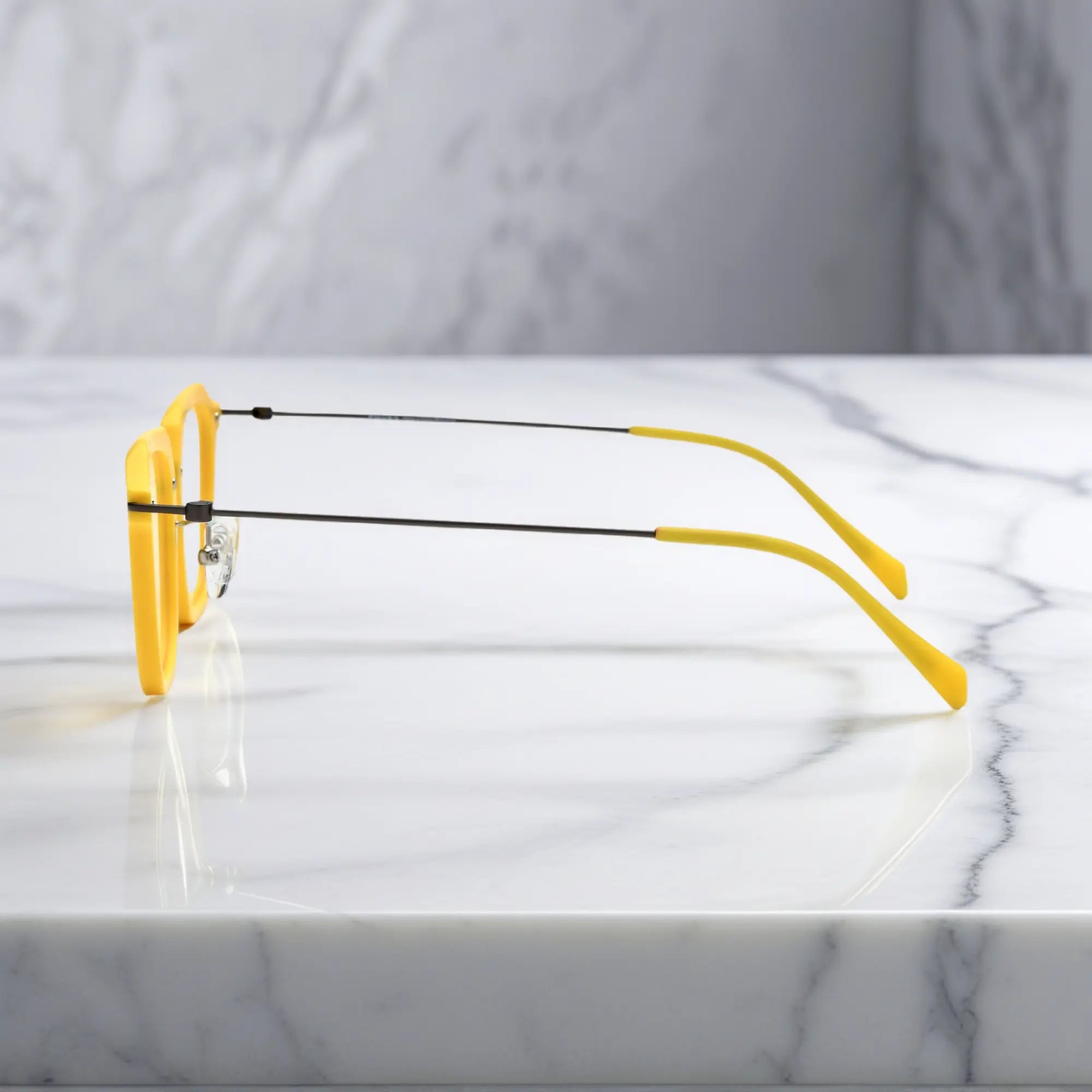 Side angle of the Sunshine Yellow variant with lightweight titanium temples and vivid color.