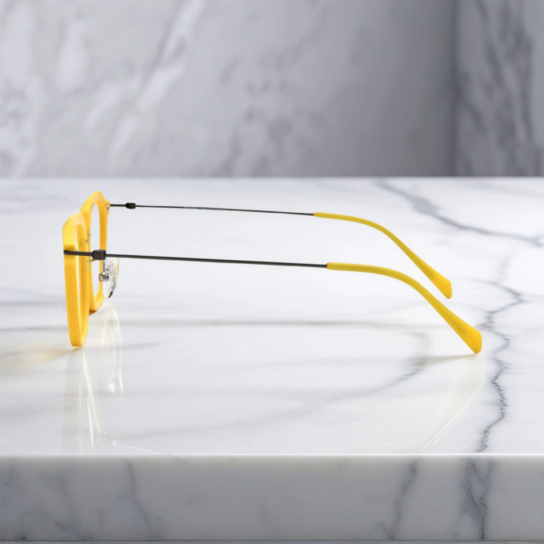 Side angle of the Sunshine Yellow variant with lightweight titanium temples and vivid color.