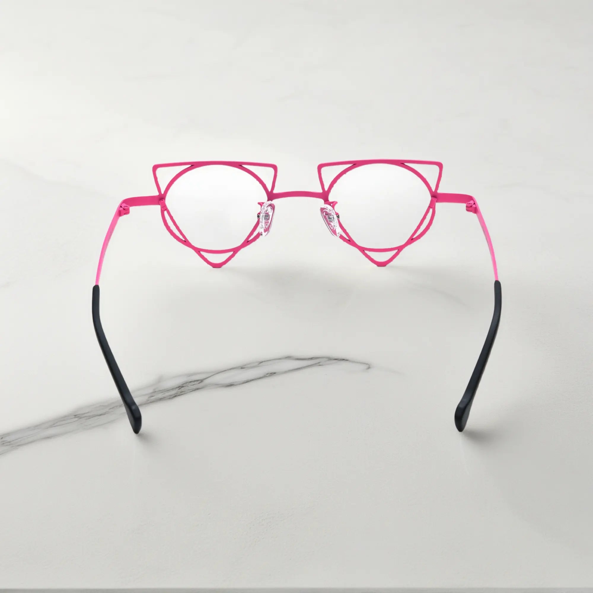 Back angle revealing artistic frame curves of VoyueLens™ Fuchsia Lime geometric glasses, crafted from lightweight titanium