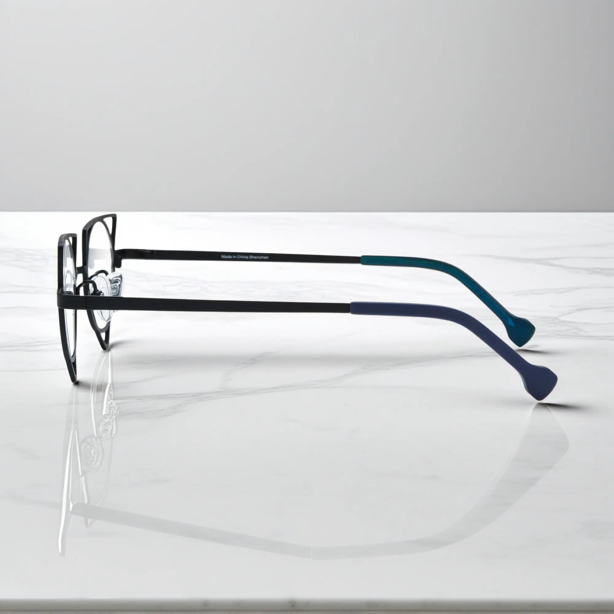 Side view showing slim titanium temples of VoyueLens™ Lime Black designer eyeglasses, ideal for modern optical styling