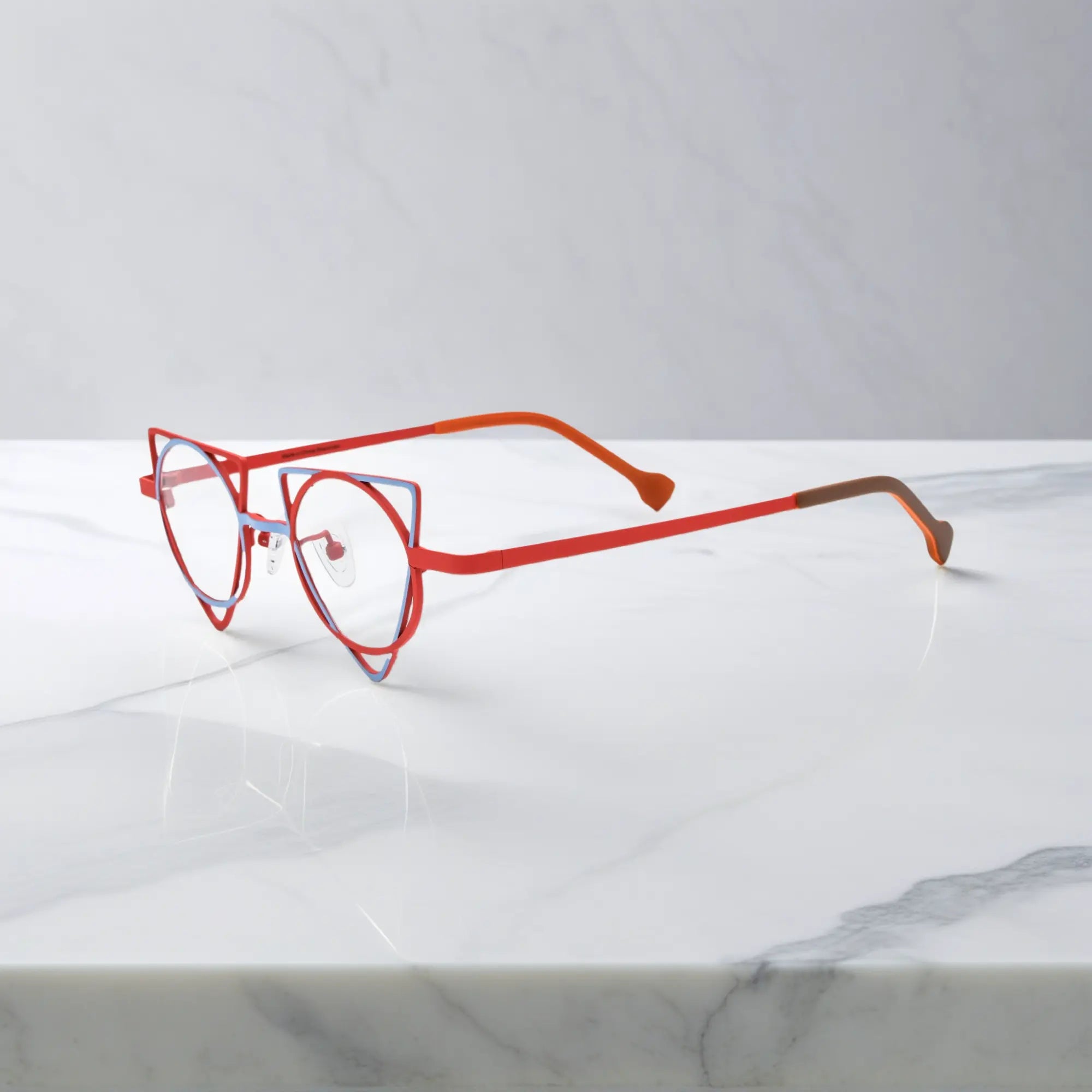 Side profile showing slim titanium temples of VoyueLens™ Skyfire Red designer eyeglasses, ideal for modern optical styling
