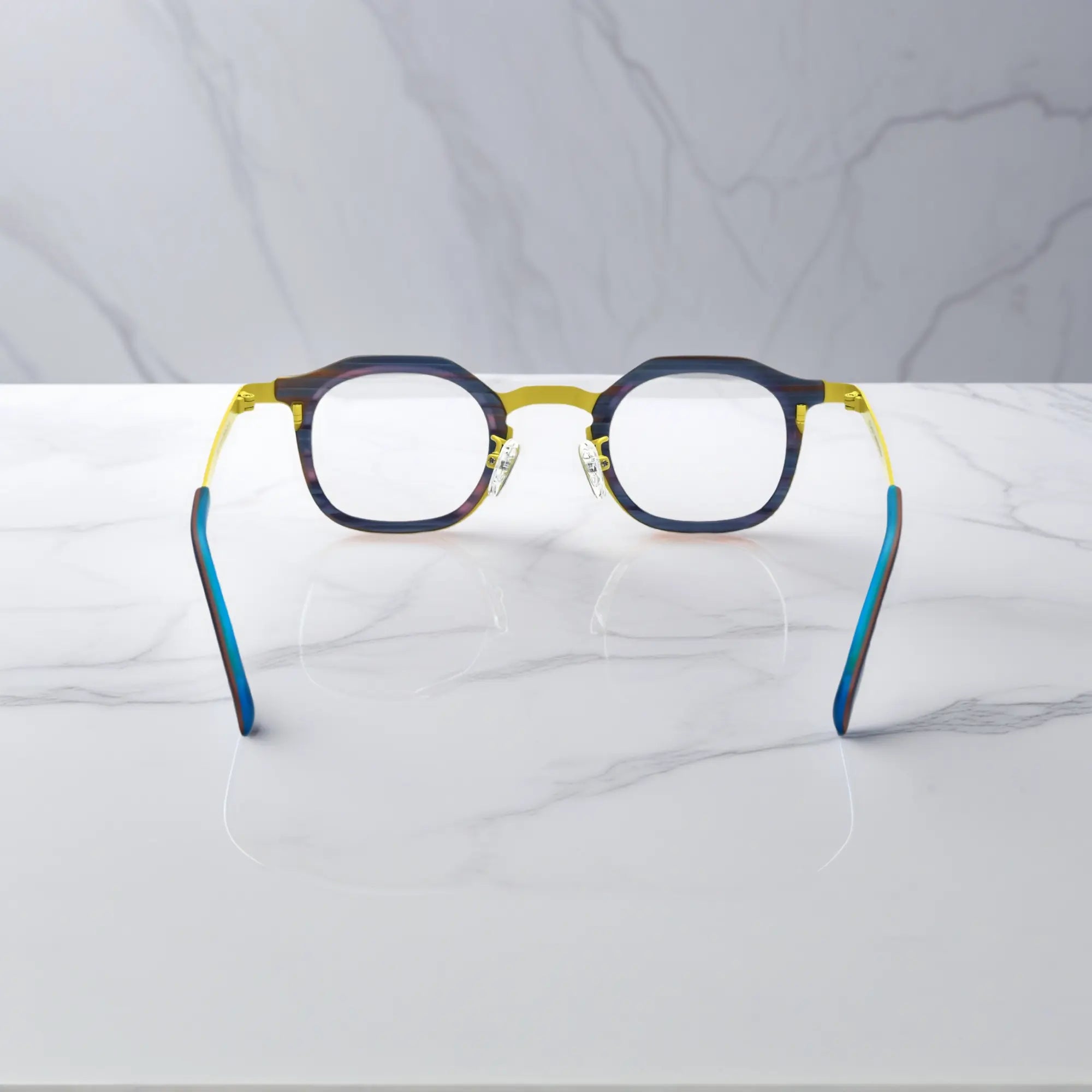 Rear view of VoyueLens™ Citrus Noir eyeglasses showing a bright yellow front and midnight navy titanium temples.
