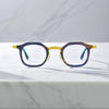 Front view of VoyueLens™ Citrus Noir square eyeglasses with a bright yellow front and midnight navy titanium temples.