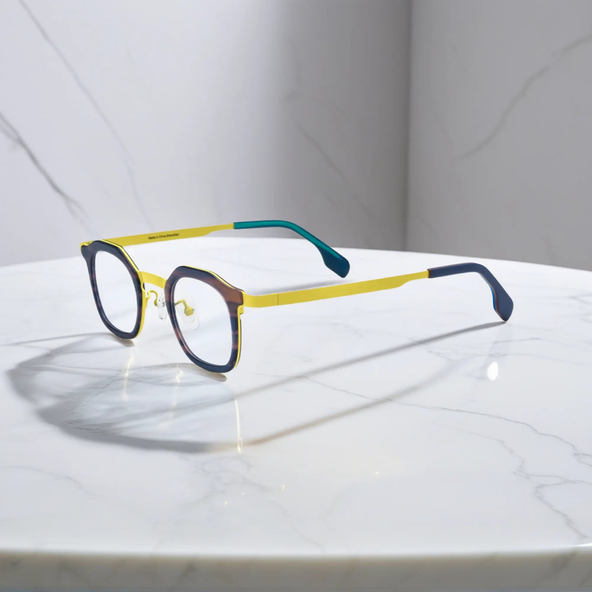 Side view of VoyueLens™ Citrus Noir square eyeglasses a bright yellow front and midnight navy titanium temples.