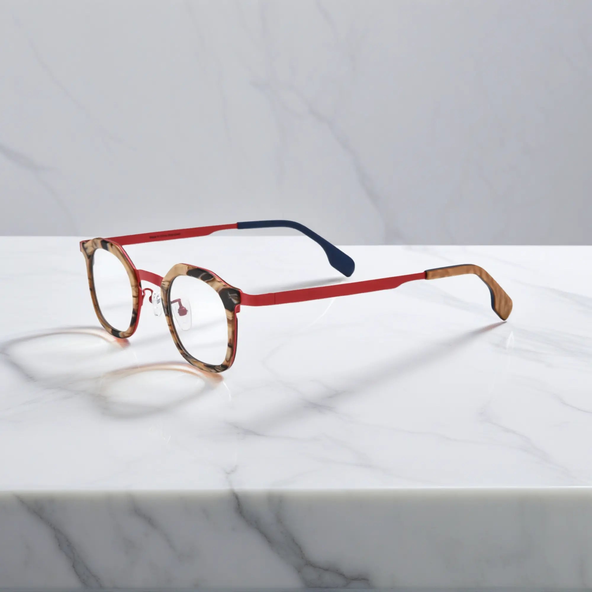 Side view of VoyueLens™ Crimson Drift square eyeglasses a warm red acetate front with amber pattern and clean titanium temples.