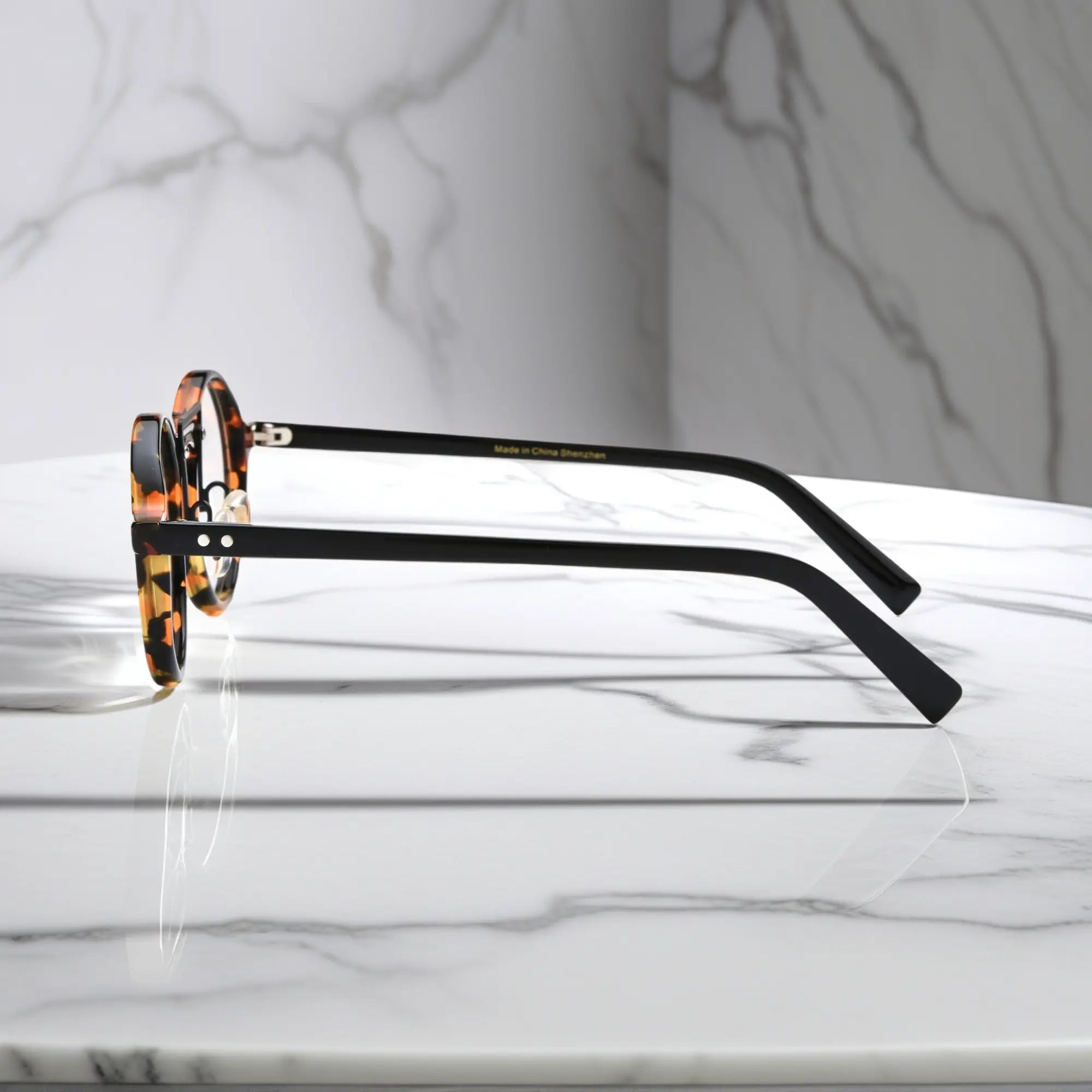 Side view of VoyueLens™ VL19194-C1 Black Tortoise eyeglasses showing lightweight temple arms and adjustable nose pads and temple flexibility