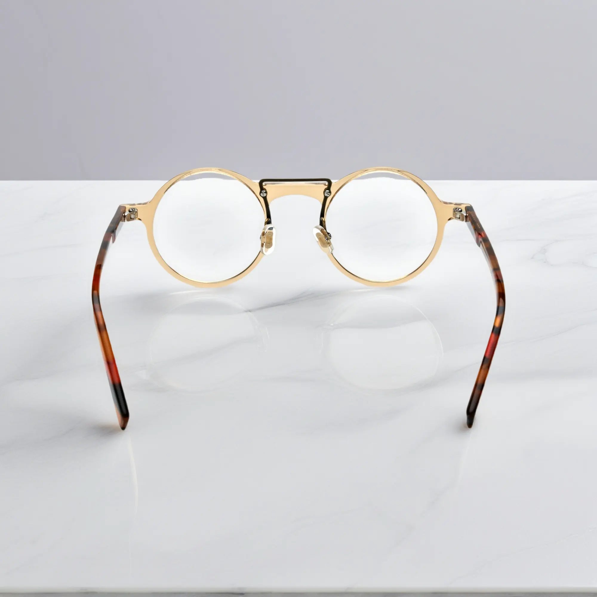 Rear view of VoyueLens™ VL19194-C2 Champagne Gold round eyeglasses showing ergonomic fit for wide faces