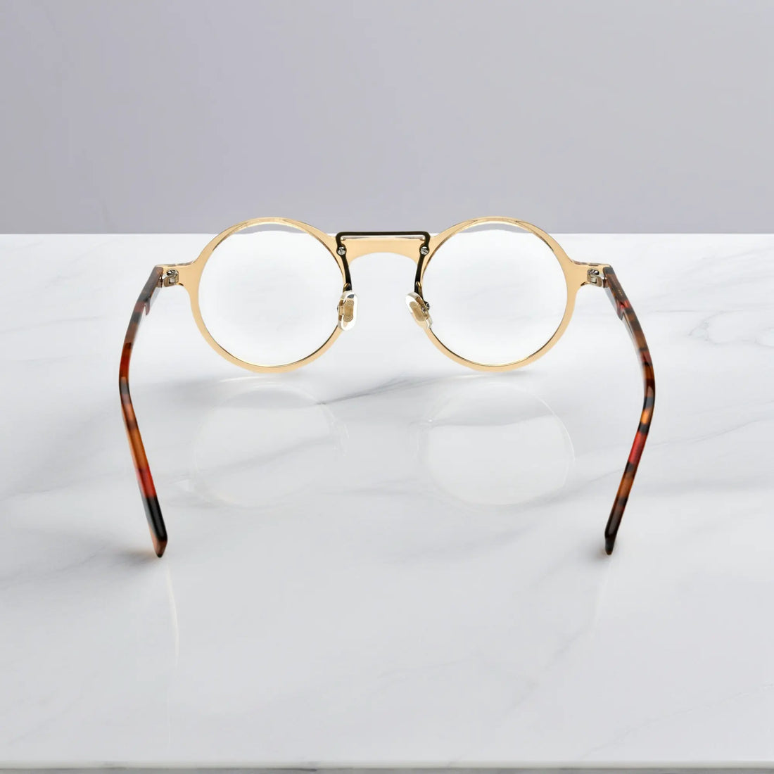 Rear view of VoyueLens™ VL19194-C2 Champagne Gold round eyeglasses showing ergonomic fit for wide faces