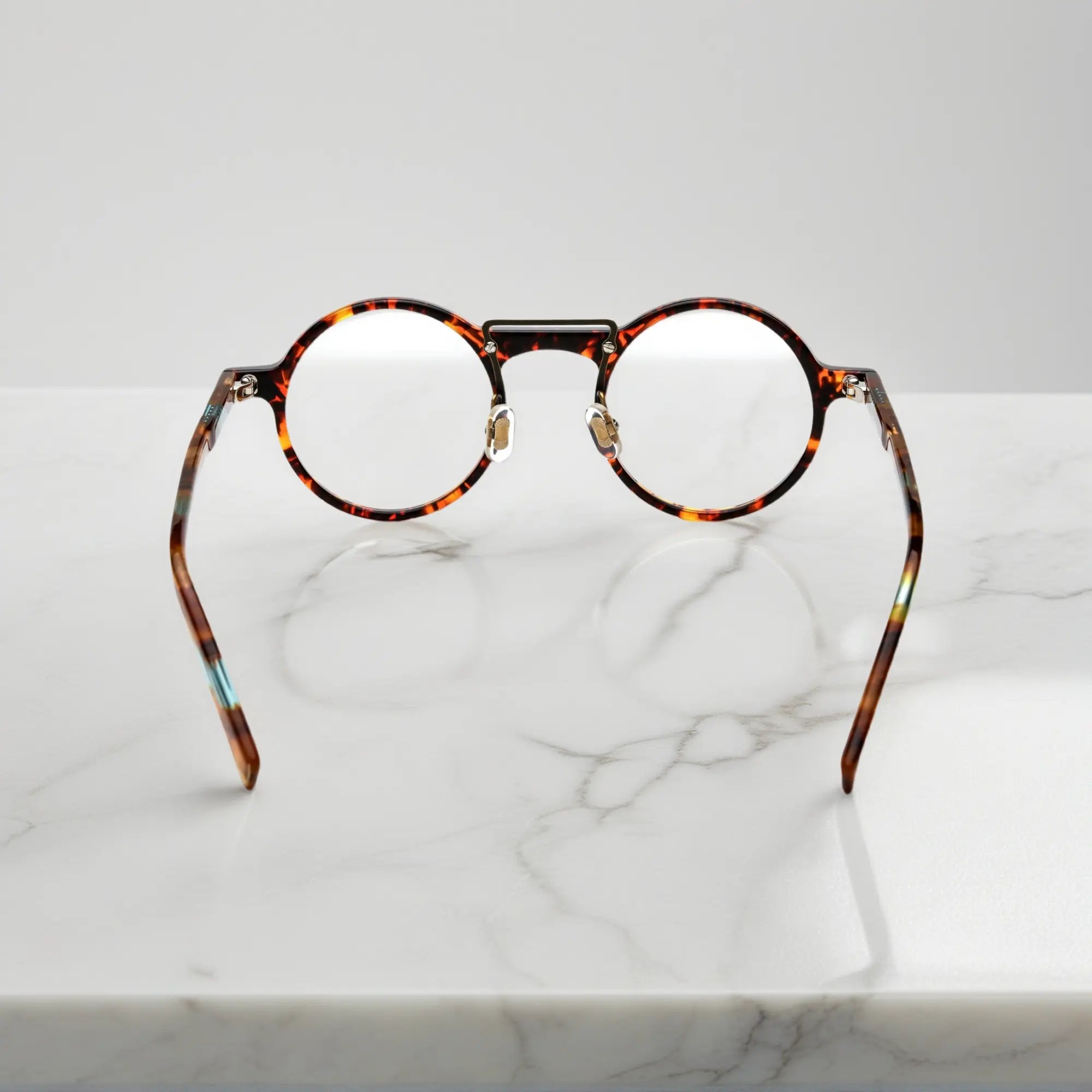 Backside of VoyueLens™ VL19194-C3 Tortoise acetate eyeglasses showing flexible temples