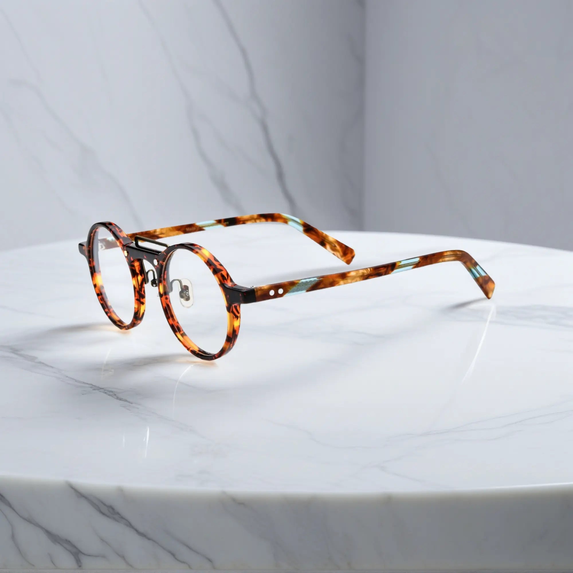 VoyueLens™ VL19194-C3 Tortoise round eyeglasses side view featuring sturdy hinges and silicone nose pads