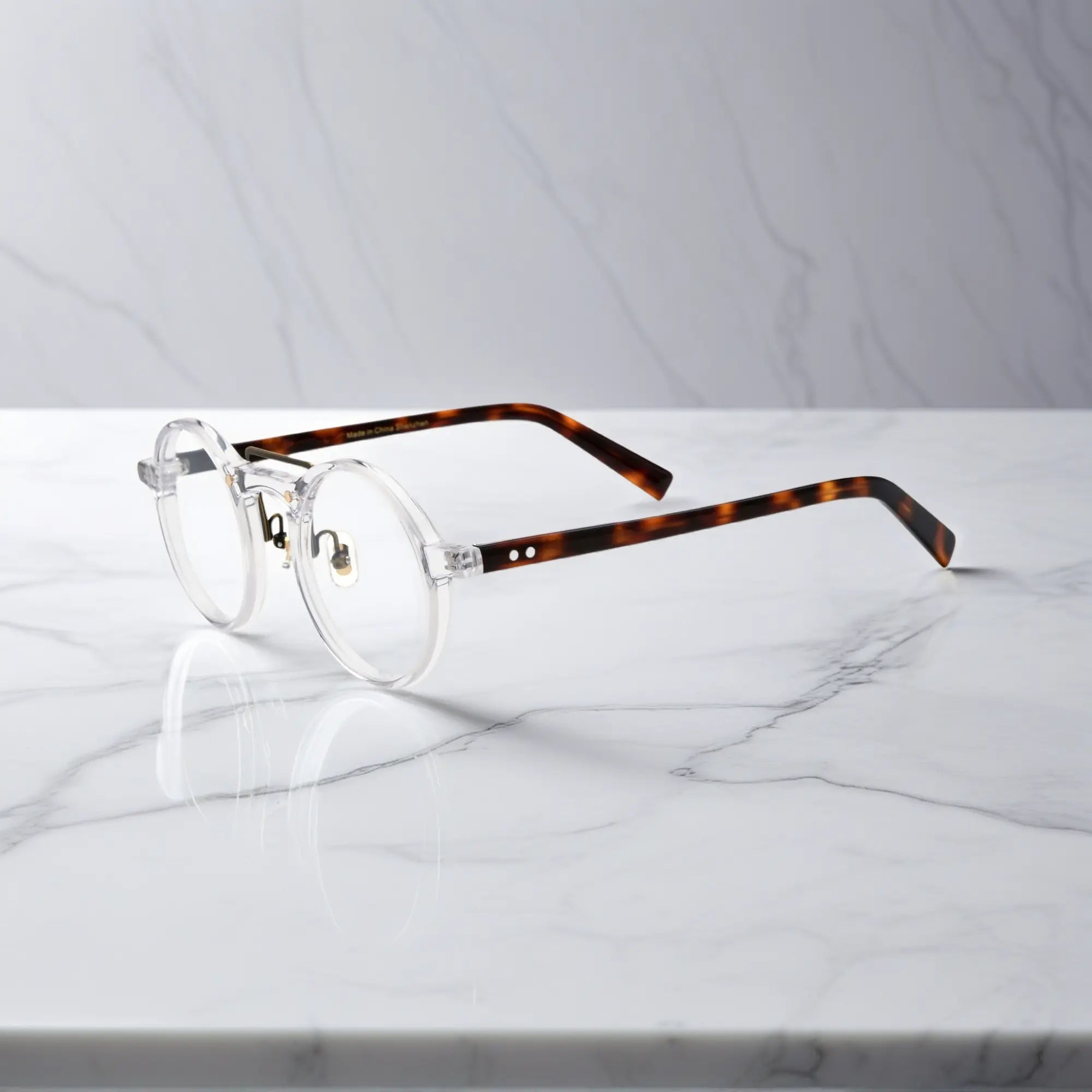 Side view of VoyueLens™ VL19194-C6 Clear eyeglasses with tortoise temple arms and soft nose pads