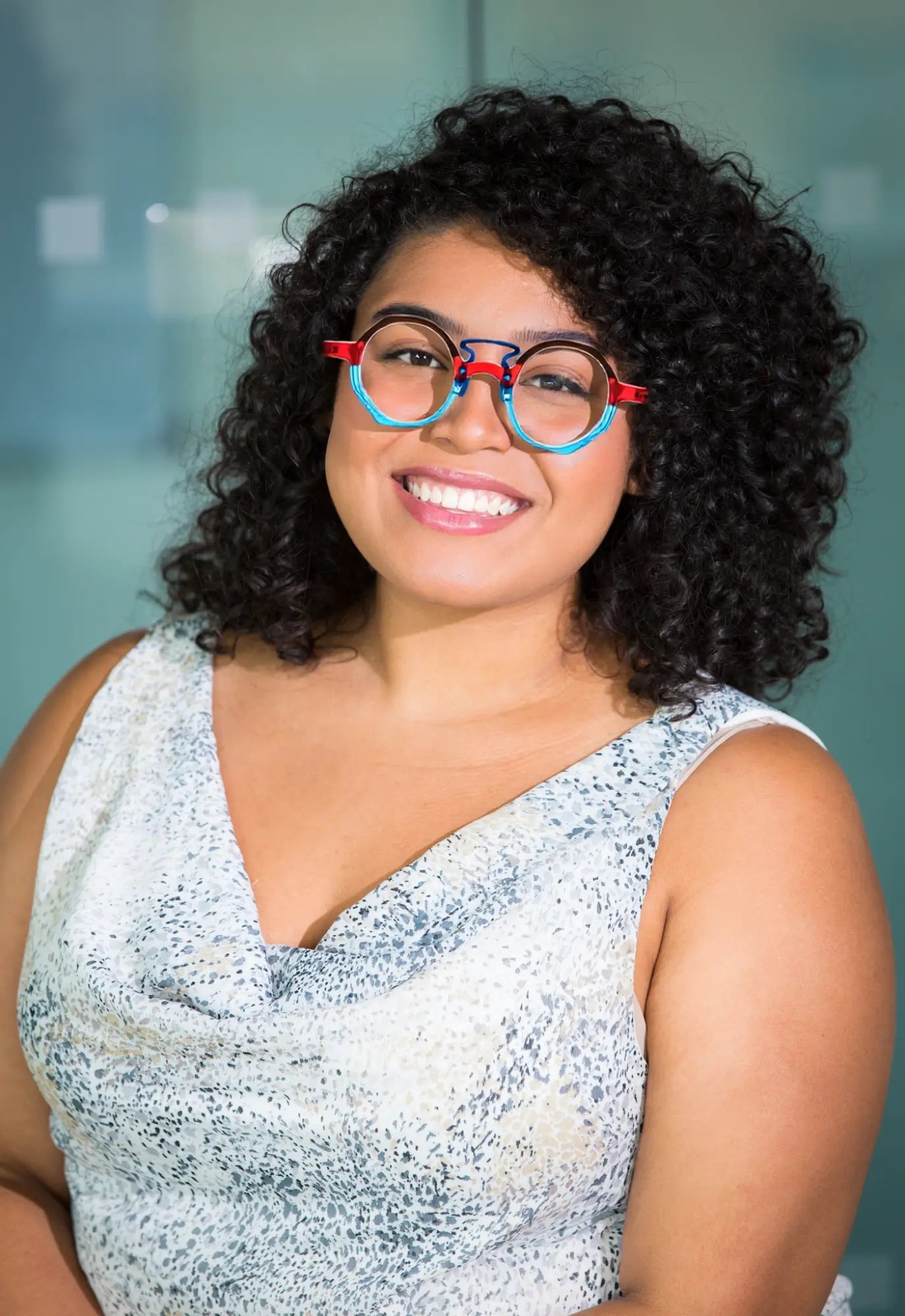 Model wearing VoyueLens™ VL19244 Crimson Blue Fusion acetate eyeglasses with a street-style fashion look for round faces