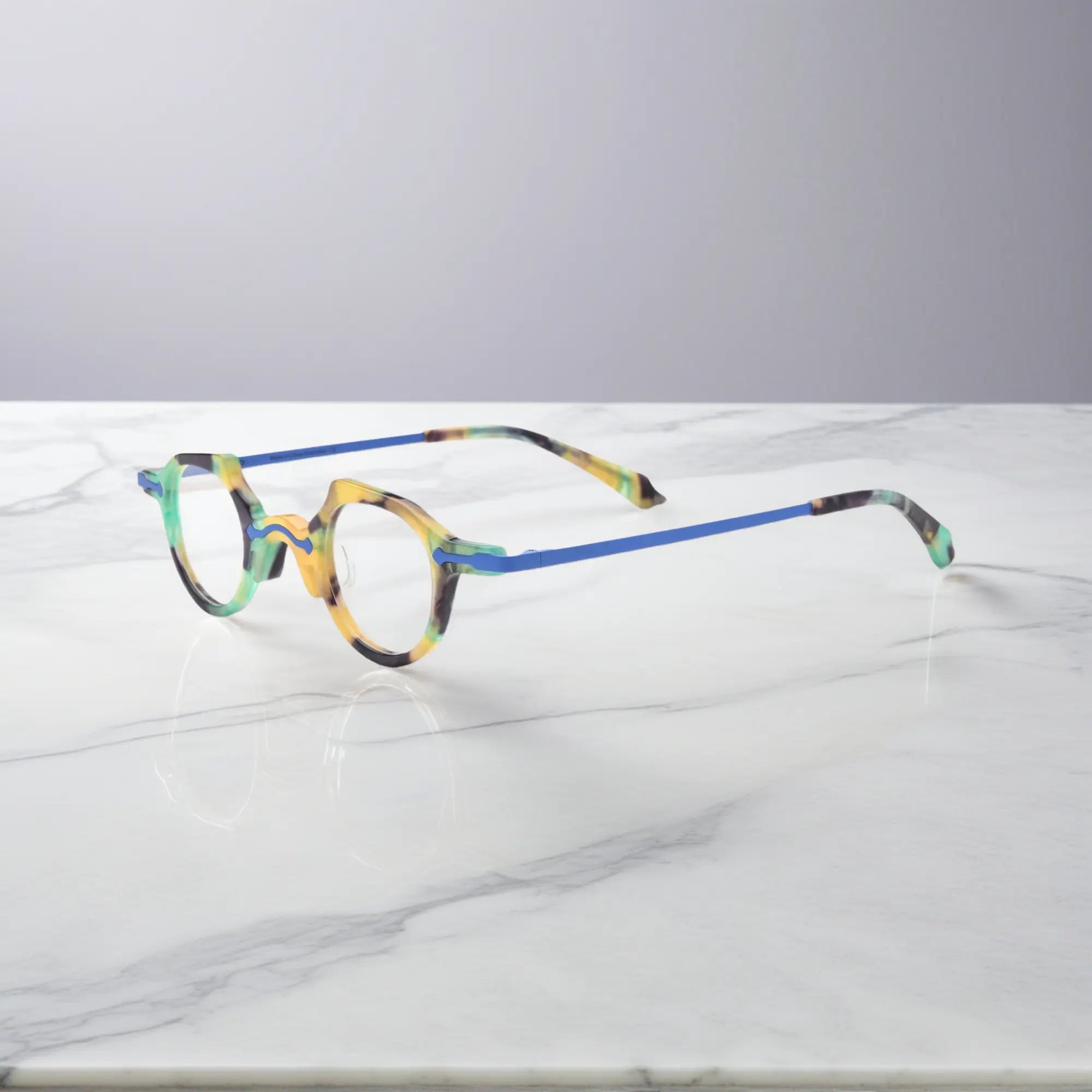 Angled side shot of the VL19341 cobalt blue frame showing ultra-lightweight metal temples and elegant frame curvature for daily comfort.