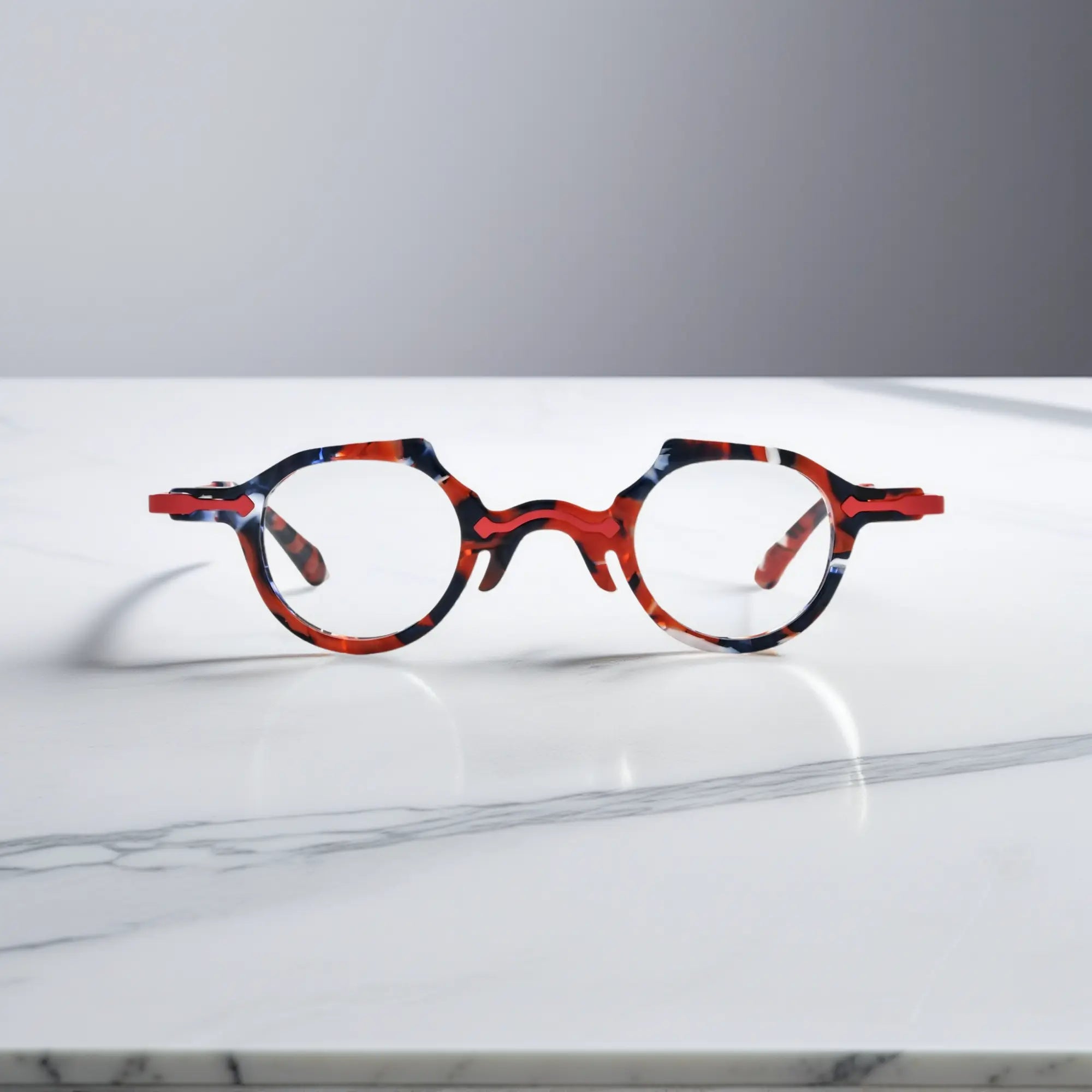 Front-facing image of VoyueLens™ VL19341 in glossy black acetate with garnet red accents, crafted in a timeless round silhouette.