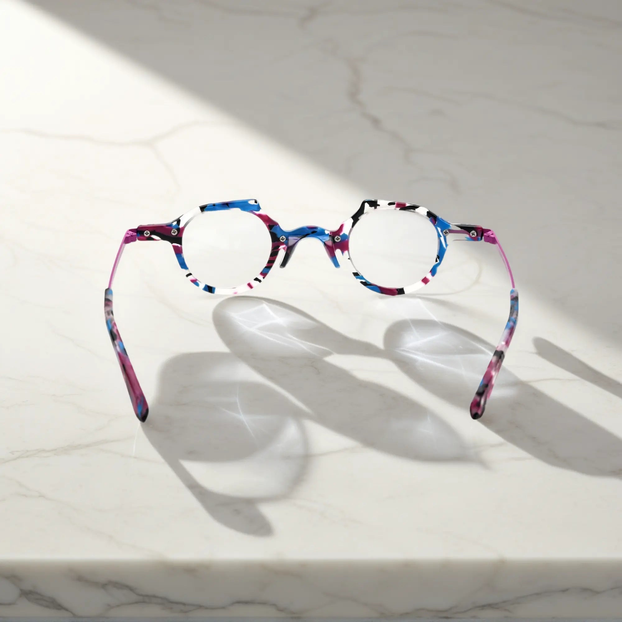 Rear view highlighting the design symmetry of the orchid purple acetate frame and sleek metallic temple construction.