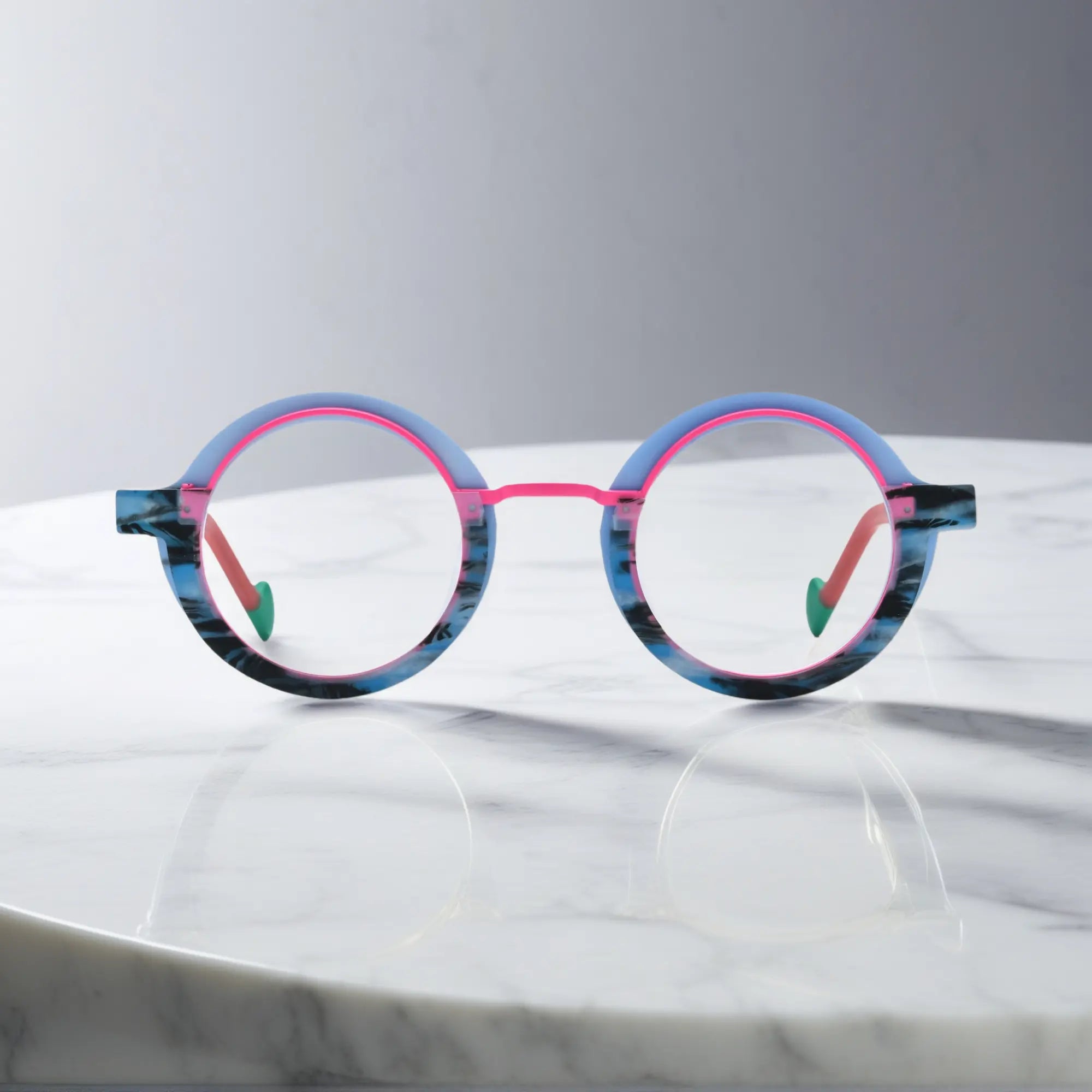 Front view of VoyueLens™ Chromatic Orbit Eyeglasses in Blue Coral showcasing its bold round silhouette and vibrant color scheme.