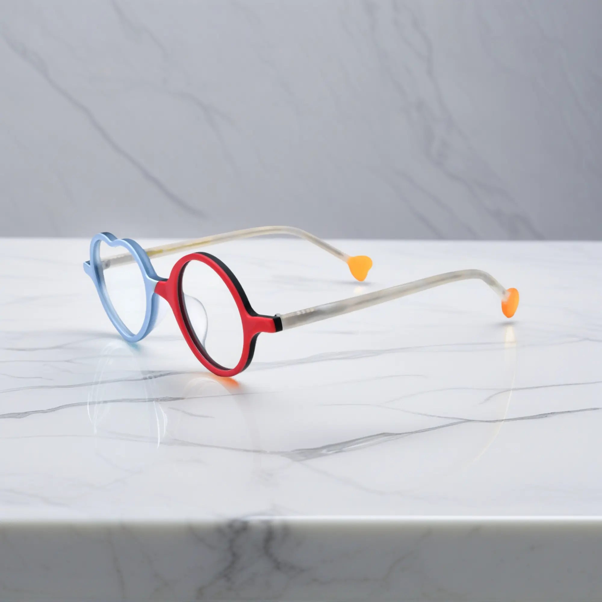 Side view of Ice Blue Cherry variant, showcasing frame thickness and temple arm structure. Cool-toned ice blue paired with a cherry red accent in playful shape.