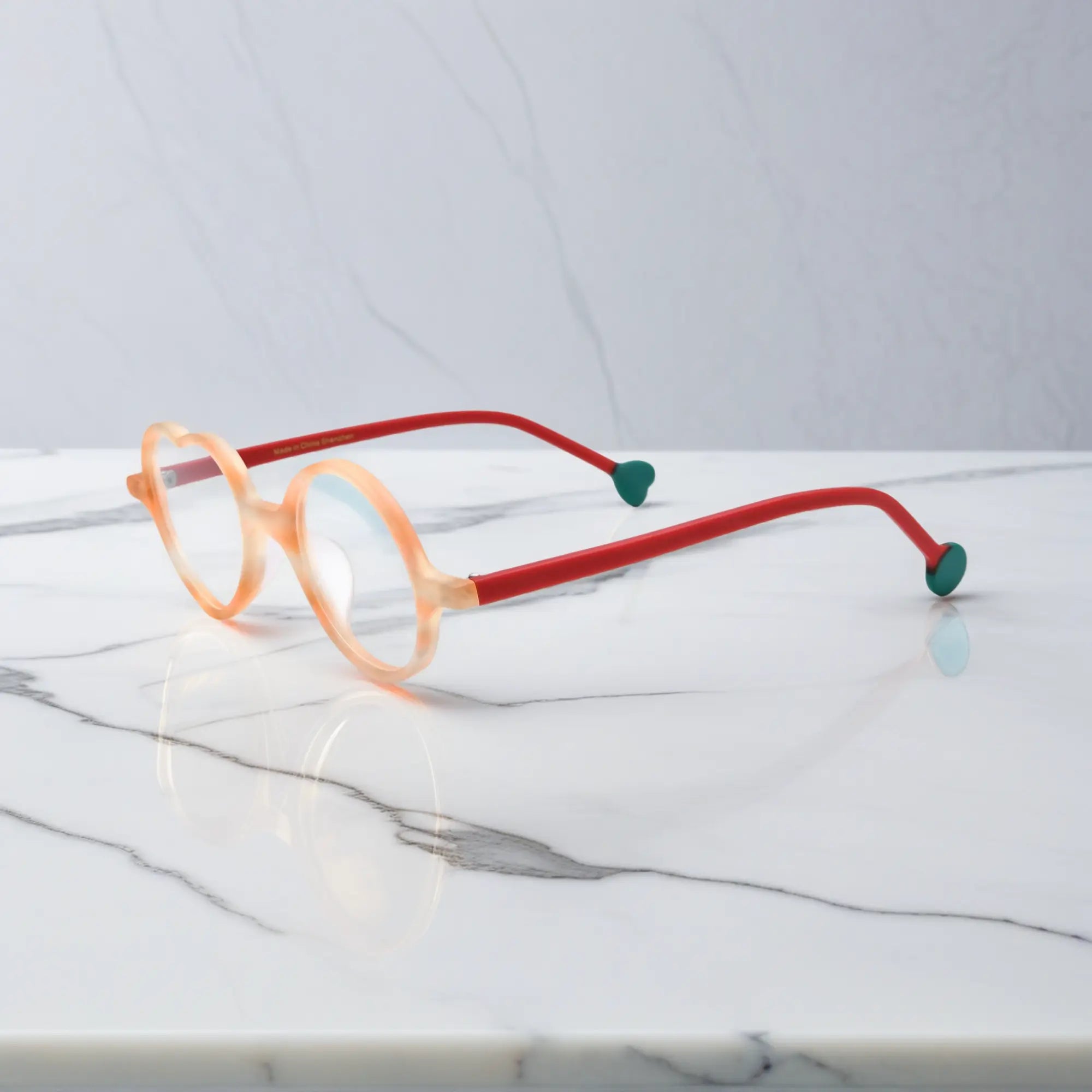 Side view of Honey Peach variant, showcasing frame thickness and temple arm structure. Soft honey yellow with peach undertone, a warm and cheerful vibe.