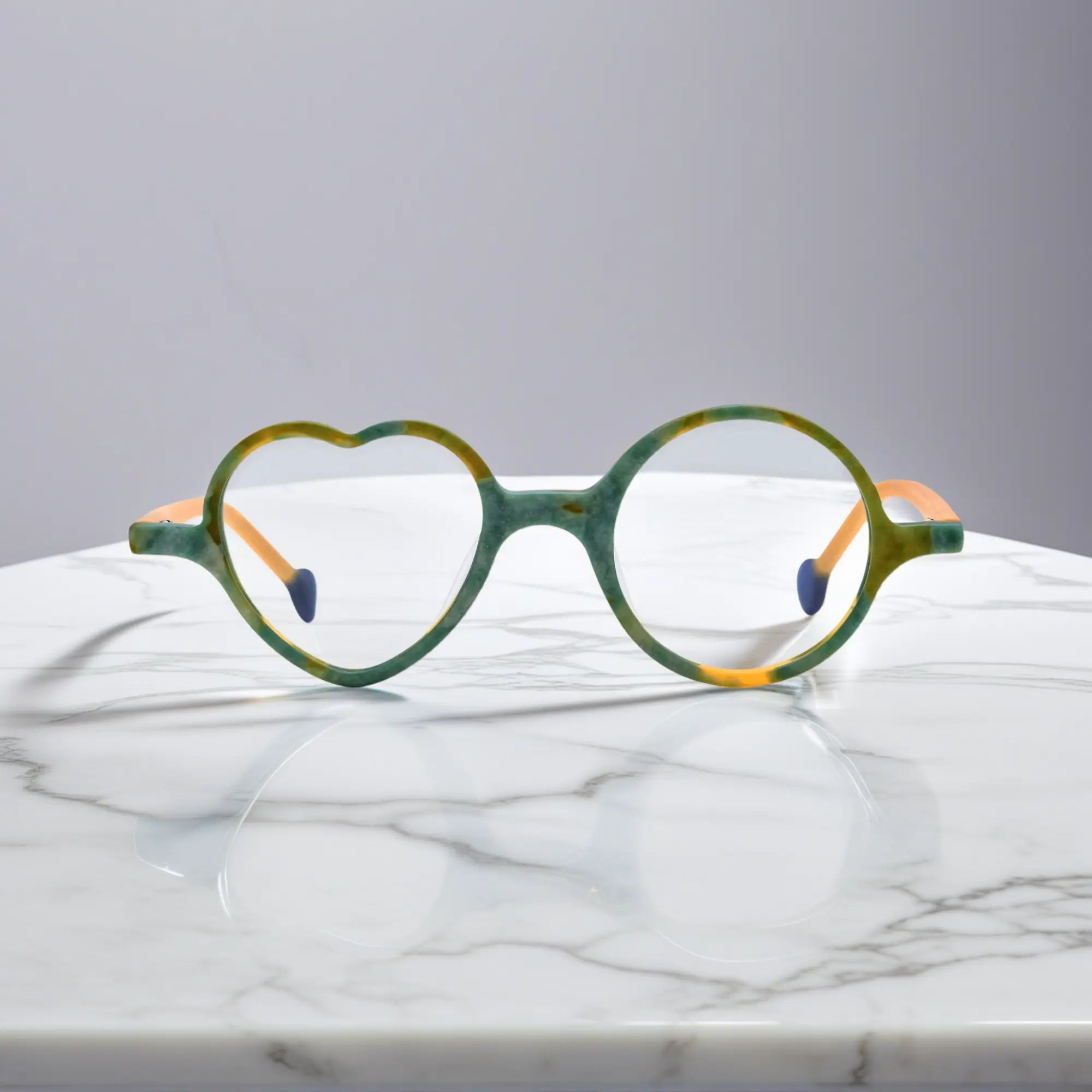 Front view of VoyueLens™ VL19377 in Citrus Jungle, highlighting heart and round lens design. Lively yellow-green frame inspired by tropical citrus and foliage.