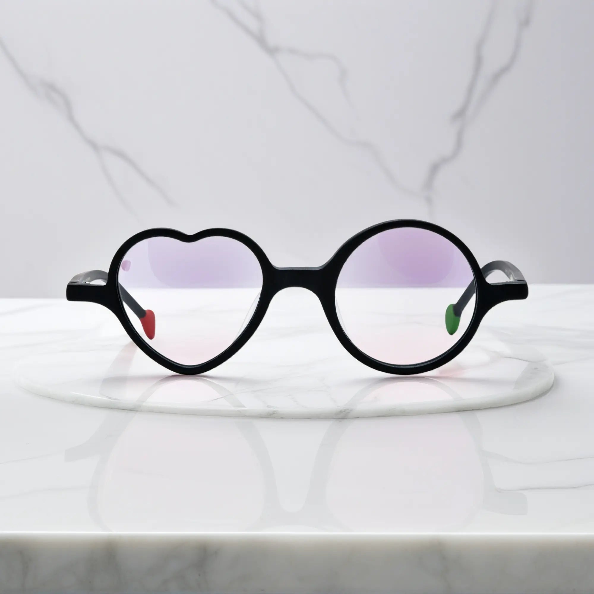 Front view of VoyueLens™ VL19377 in Charcoal Dusk, highlighting heart and round lens design. Minimalist all-black frame with subtle matte texture and modern shape.