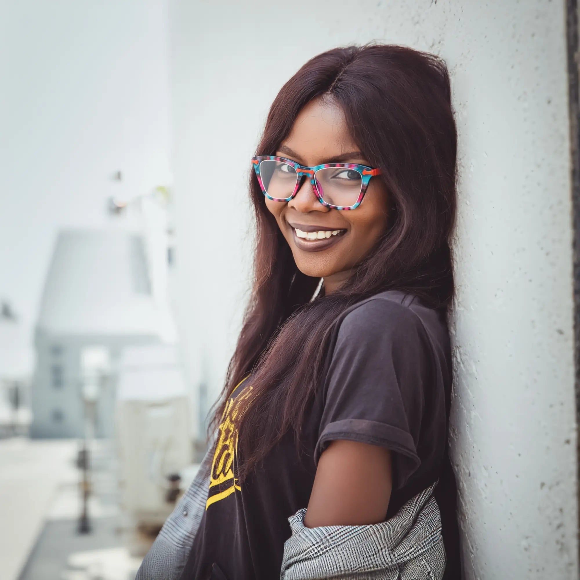 Model wearing VoyueLens™ ColorPop Cat-Eye Eyeglasses in Coral Pop, showcasing the statement-making, vintage-inspired style perfect for fashion or prescription use.