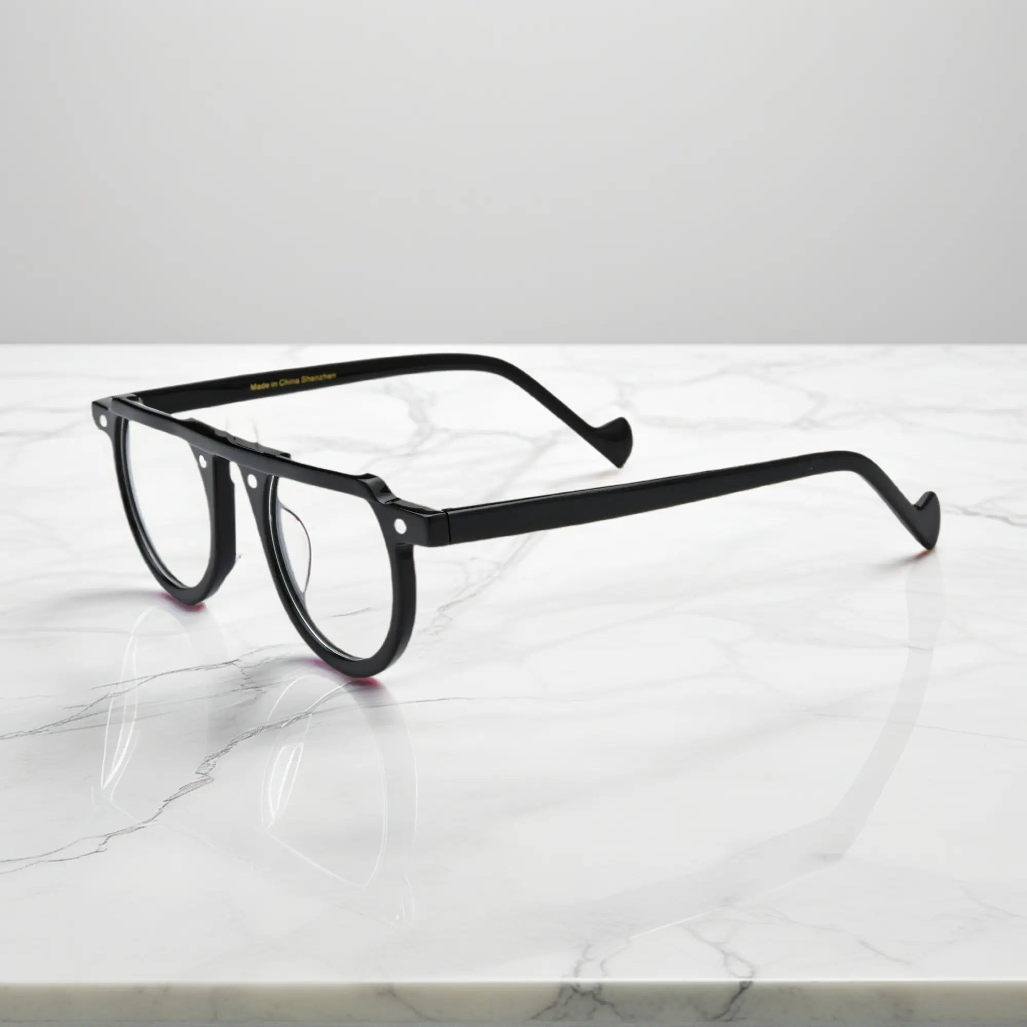 Sleek side profile of Charcoal Black round acetate glasses from VoyueLens™