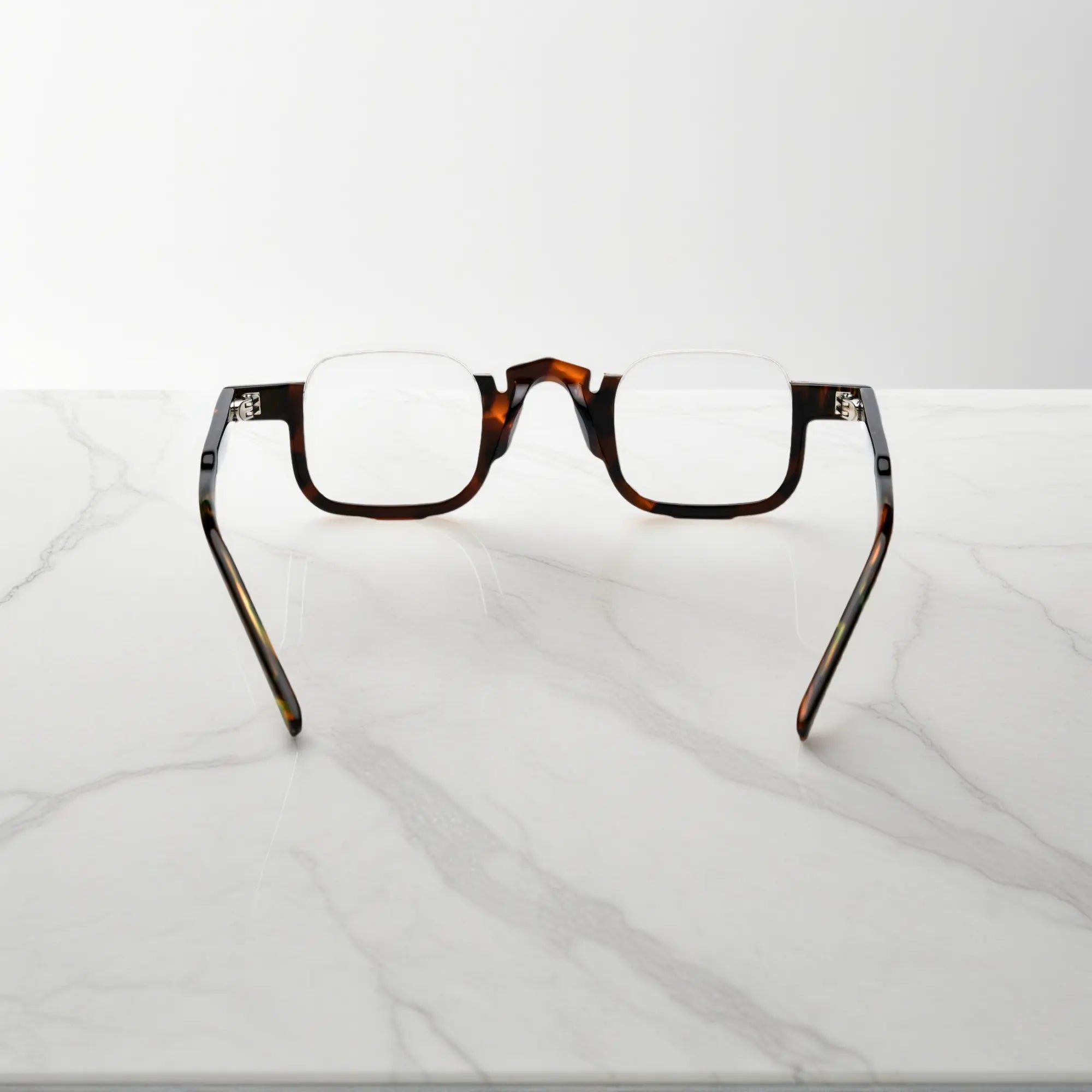 Back view of VoyueLens™ acetate eyeglasses in warm tortoise color, lightweight square prescription-ready frame