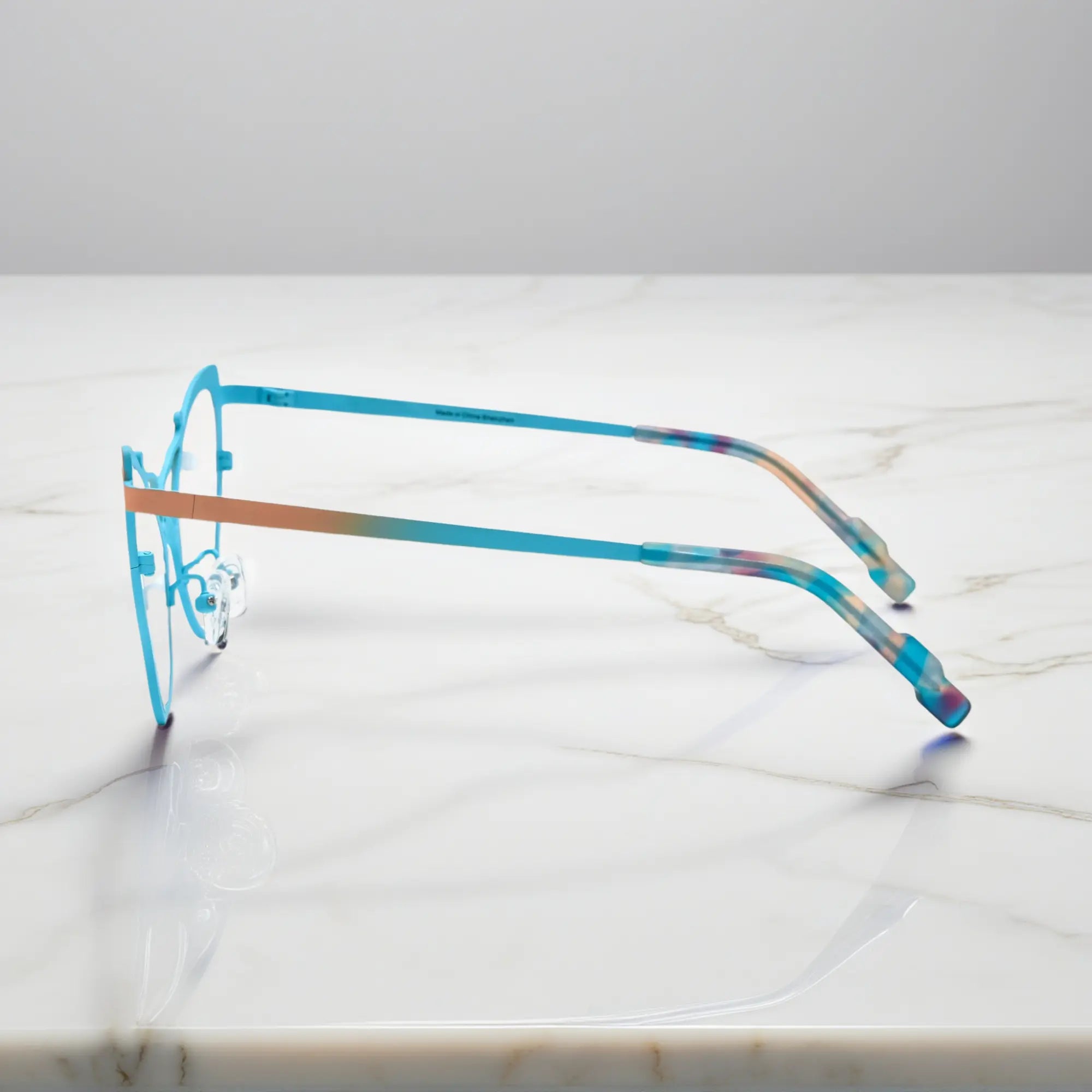 Side of VoyueLens™ VL185862 titanium butterfly eyeglasses in Yellow Blue – a lightweight, colorful, vintage-inspired, prescription ready frame designed for unique artistic style and everyday comfort.